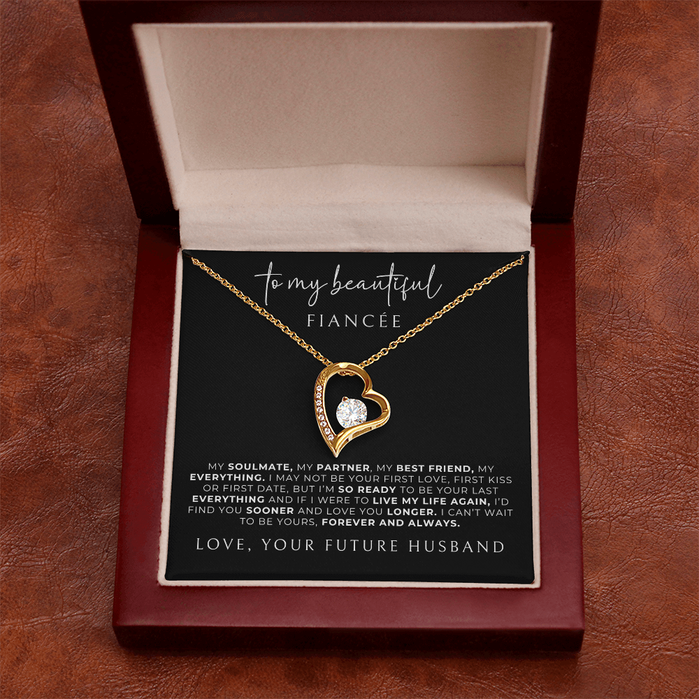 gold heart necklace in luxury gift box with message card from fiance. 