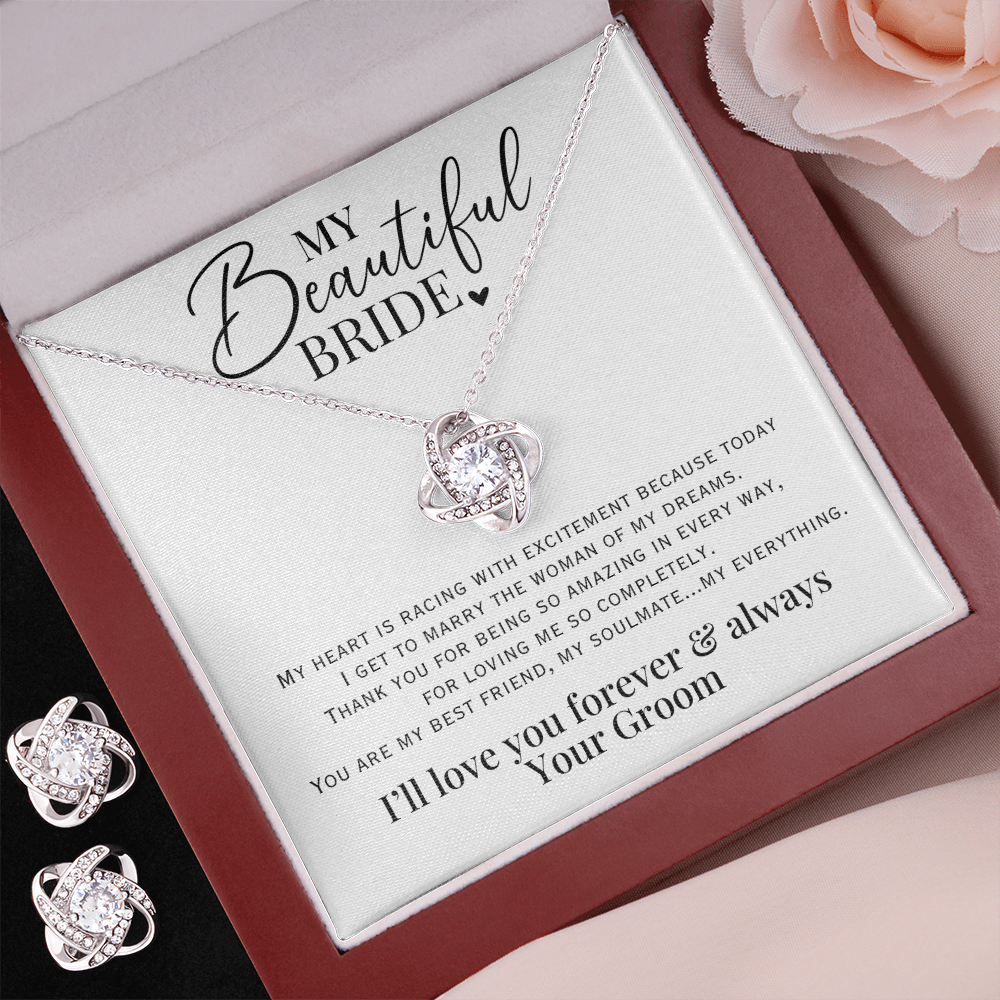 Beautiful wedding day gift for your bride, white gold love knot necklace & earring set with heartfelt message from groom.