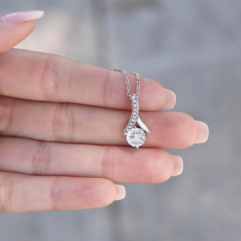 Close-up of a stunning promise necklace for girlfriend, featuring a sparkling ribbon pendant—perfect for anniversaries and special moments.