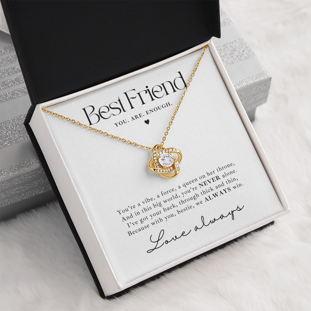 gold Love Knot necklace gift for besties with empowering message card saying 'You are enough'. the jewelry makes a heartfelt gift for a best friend going through a tough time