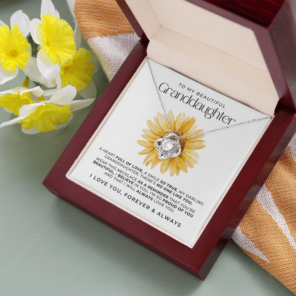 white gold love knot necklace to my beautiful granddaughter with a message card featuring a sunflower and sweet message from grandma or grandpa.