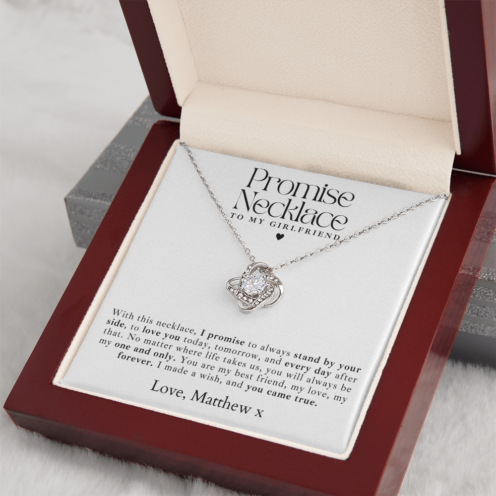 A beautiful white gold promise necklace for girlfriend, featuring a delicate love knot pendant in a luxury lighted gift box.