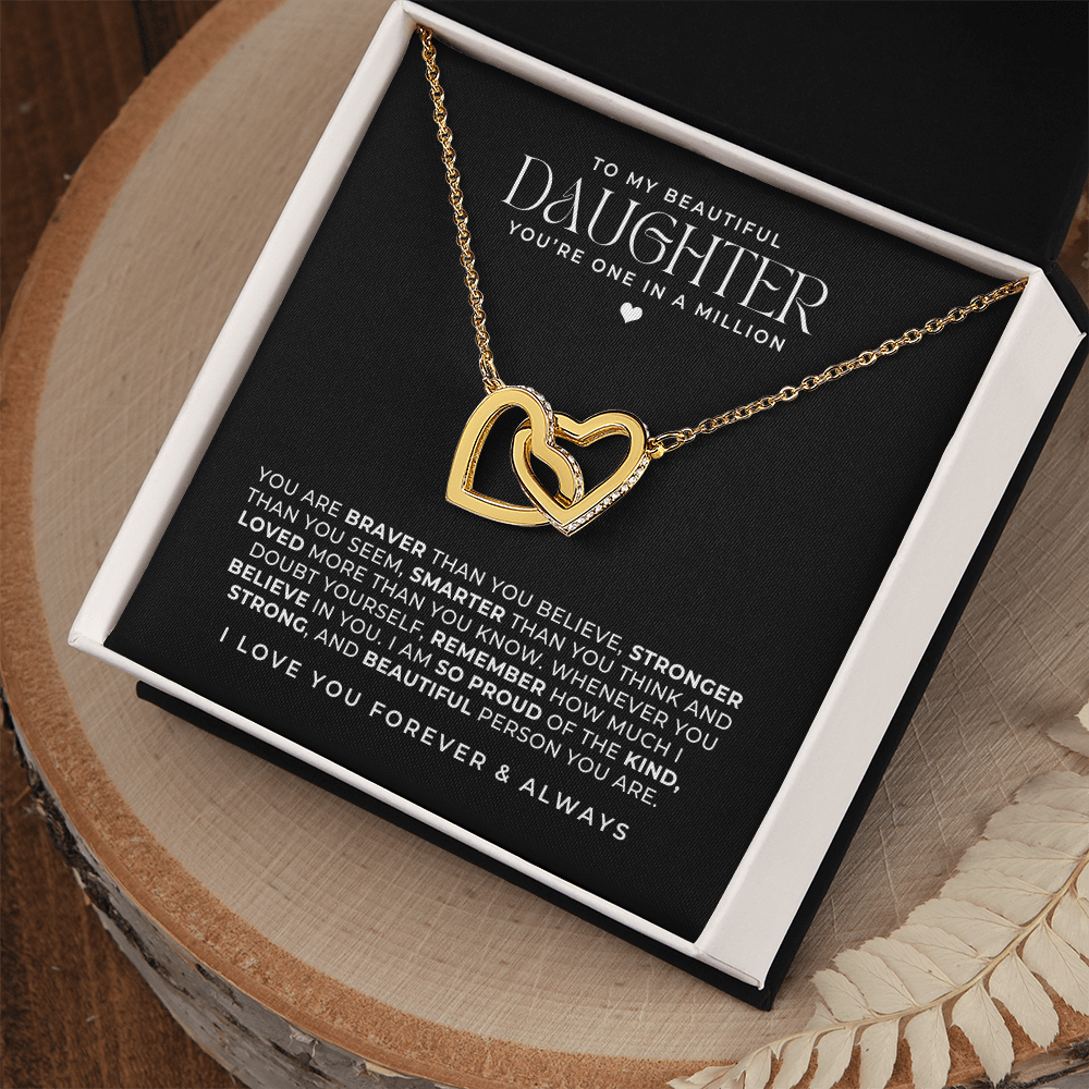 beautiful gold interlocking hearts necklace in a gift box with a message card that says to my daughter and a loving note a good birthday gift idea for her.