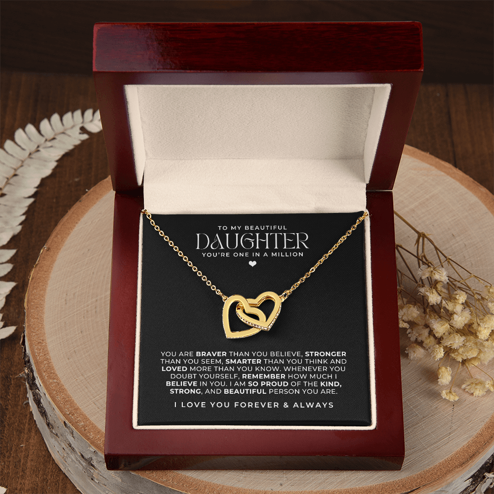 18k gold interlocking hearts necklace in a luxury gift box with a message card that says to my daughter and a loving note intended as a birthday gift for her.