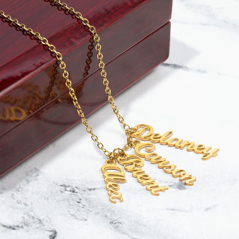 Personalized 4 name gold necklace for mom with multiple names suspended from a 18k gold chain, presented in a luxury gift box for Mother’s Day.